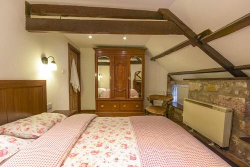 a bedroom with a large bed in a room at Rafters in Alnmouth