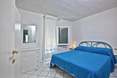 Ένα ή περισσότερα κρεβάτια σε δωμάτιο στο Apartments in residence with swimming pool in Porto Rotondo