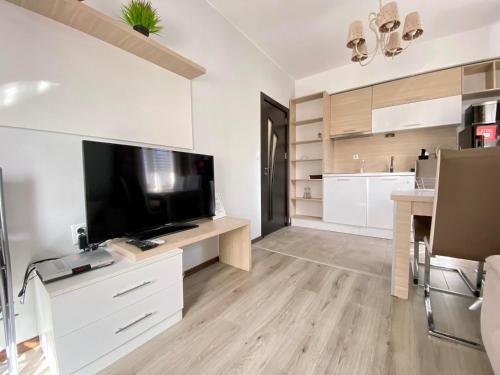 a large living room with a large flat screen tv at The Green Paradise Apartments in Primorsko