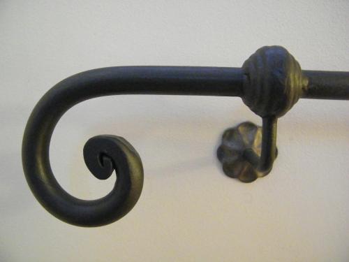 a black metal object with a knob on a wall at Agriturismo Villalta in Ponte Felcino