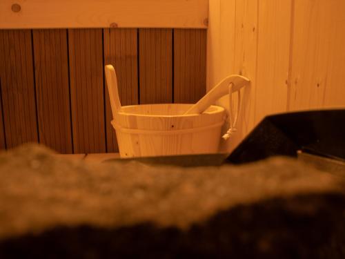 a plastic basket sitting in the corner of a room at Chalet Deluț in Suceava