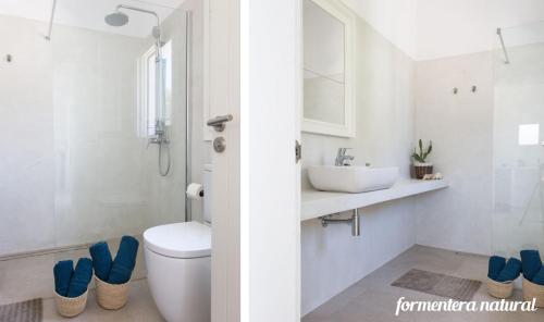 biała łazienka z toaletą i umywalką w obiekcie Casas Emma y Sofía - Porto Sale - Formentera Natural w mieście Sant Francesc Xavier