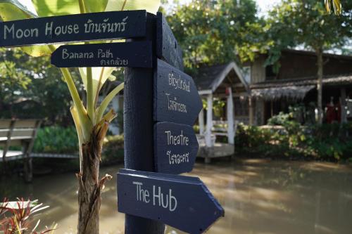 a sign for a garden with names on it at Art House at Chiangdao - Waterlily House in Chiang Dao