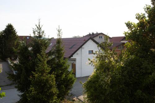 a white house with a red roof at AppPrusnik in Ljubljana