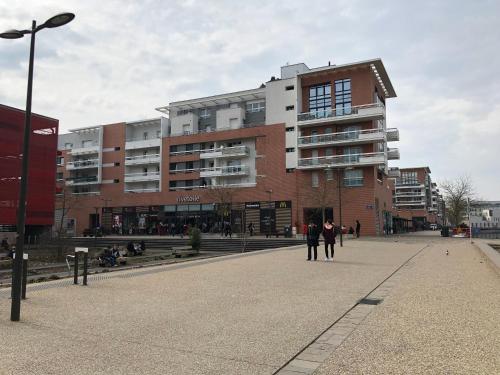 a group of people standing in front of a building at F2 côté UGC climatisé plein centre parking gratuit in Strasbourg