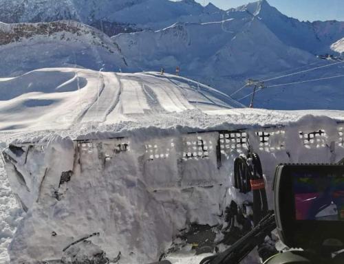 a road covered in snow with a mountain in the background at Haus Bergblick in Spiss