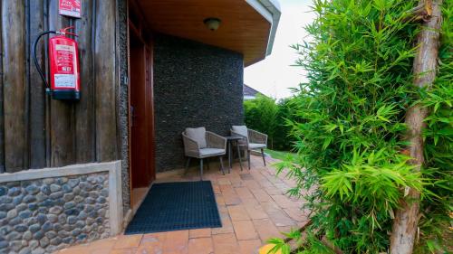 an entrance to a house with a table and chairs at Aberdare Prestige & Royal Cottages in Nanyuki