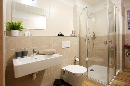 Salle de bains dans l'établissement Rezidence Šumava