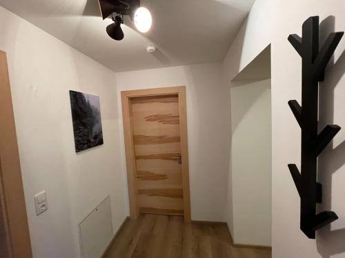 a hallway with a door and a cactus at Wonder & Wander in Ehrwald