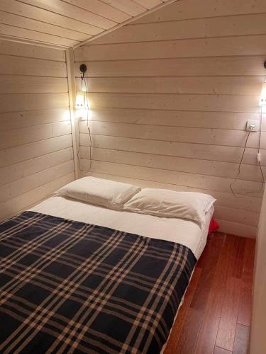 Ένα ή περισσότερα κρεβάτια σε δωμάτιο στο Yamina Lodge