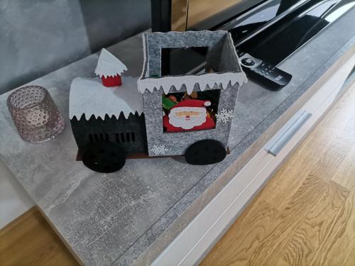 a cake shaped like a train on a table at Apartman Mima in Sombor