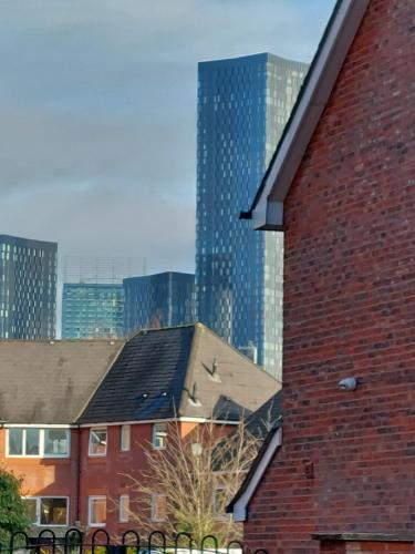a brick building with a city in the background at bankwellstreet in Manchester