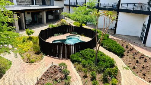 an overhead view of a garden with a swimming pool at City Living Apartment 119 - Private Balcony, Washing Machine & Fast WiFi in Johannesburg
