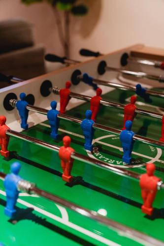 a group of people playing a game of snooker at Chalet La Canopée -familial par excellence MontBlanc in Mont-Blanc