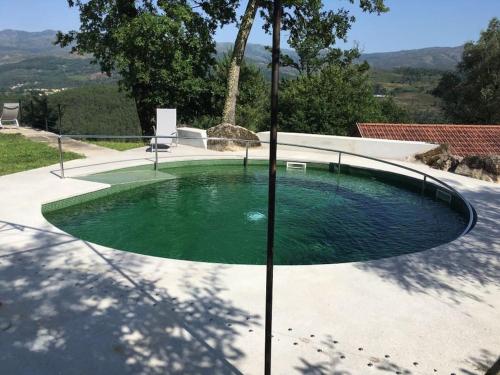 a small pool of water in a yard at GoToGeres - Casa da Cortiça - Sobrenatura in Arcos de Valdevez