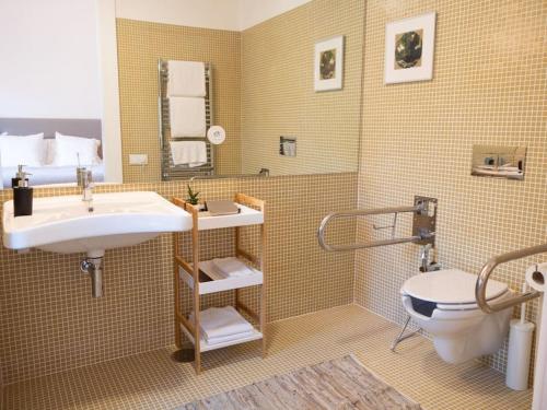 a bathroom with a sink and a toilet at GoToGeres - Casa da Cortiça - Sobrenatura in Arcos de Valdevez