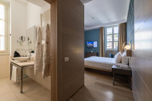 Ένα ή περισσότερα κρεβάτια σε δωμάτιο στο Grand Hotel Alassio Beach & Spa Resort - The Leading Hotels of the World