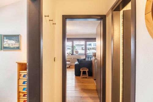 a hallway with a door leading to a living room at Haus Excelsior Top 37b in Seefeld in Tirol