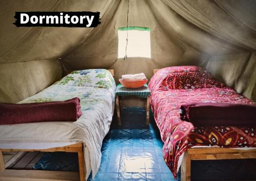 Letto o letti in una camera di Eselbe Camp Backpackers