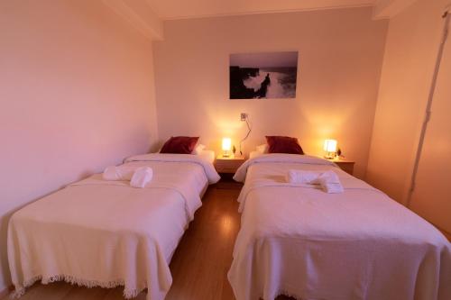 En eller flere senge i et værelse på Snæfellsjökull Apartments