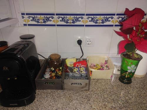 a kitchen counter with a box of food and a toaster at Casa Rural Sarrion in Teruel