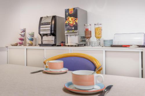 Kaffe- og tefaciliteter på Hôtel Ariane