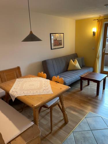 a living room with a couch and a table at Appartement Valentin in Ehrwald