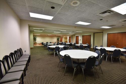a conference room with tables and chairs in it at Red Roof Winchester - Lexington East in Winchester
