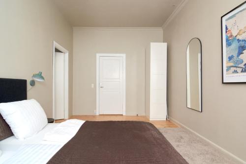 Ένα ή περισσότερα κρεβάτια σε δωμάτιο στο Scandinavian Style 3BR in Copenhagen City Centre