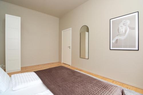 Ένα ή περισσότερα κρεβάτια σε δωμάτιο στο Scandinavian Style 3BR in Copenhagen City Centre