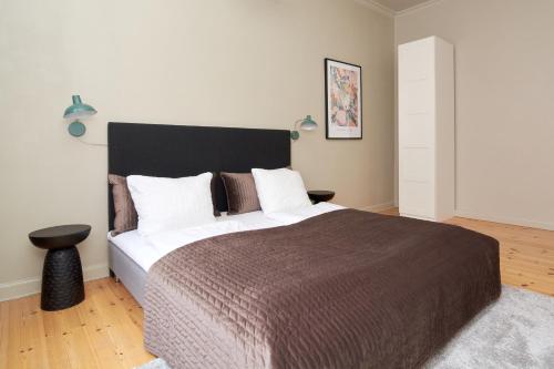 Ένα ή περισσότερα κρεβάτια σε δωμάτιο στο Scandinavian Style 3BR in Copenhagen City Centre