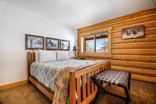 a bedroom with a bed and a bench in it at Ranch Home in Glenwood Springs