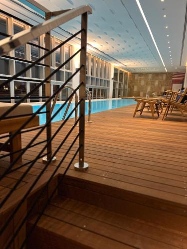 a swimming pool on the deck of a cruise ship at Karpaz Gate Marina Hotel in Ayia Trias