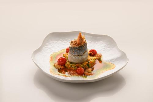 a plate of food with a dessert on it at Inspira Liberdade Boutique Hotel in Lisbon