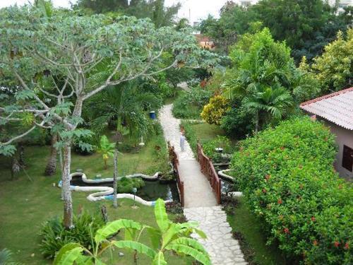 an aerial view of a garden with a walkway at Plaza Real Resort in Juan Dolio