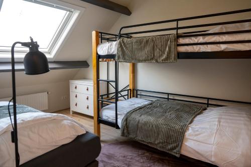 Ένα ή περισσότερα κρεβάτια σε δωμάτιο στο 5 persons Holiday Home Comfort