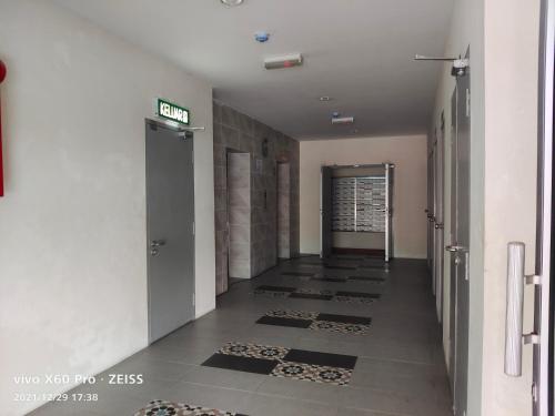 a hallway of a building with ailed floor at Pavilionvillie M1T584 by irainbow in Simpang Pulai