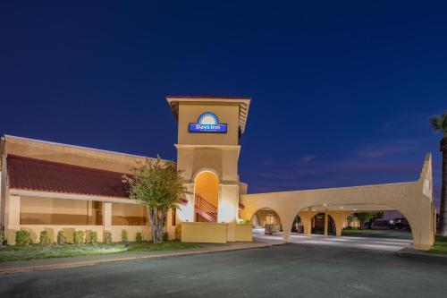 a hotel with a sign on top of a building at Days Inn by Wyndham Del Rio in Del Rio