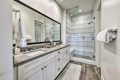 a bathroom with a shower and a sink and a mirror at Elegant Indio Home with Private Pool and Spa! in Indio