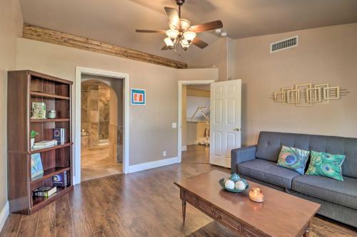 a living room with a couch and a table at Lavish Family Escape with Game Room in Avondale! in Avondale