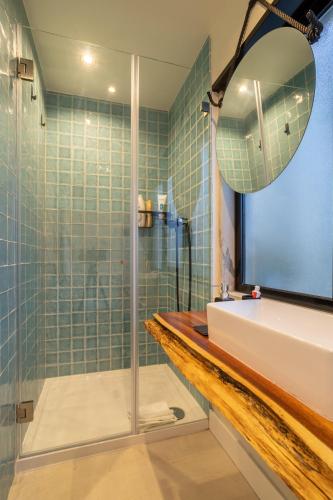 a bathroom with a sink and a shower at Vila Fresca Apartment in Azeitao