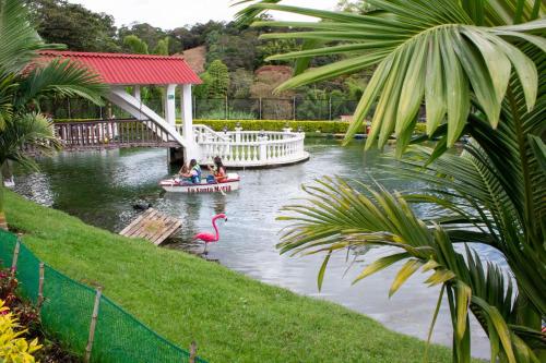 a group of people on a boat in a pond at La Gran Estancia Hotel Campestre in Chachagüí