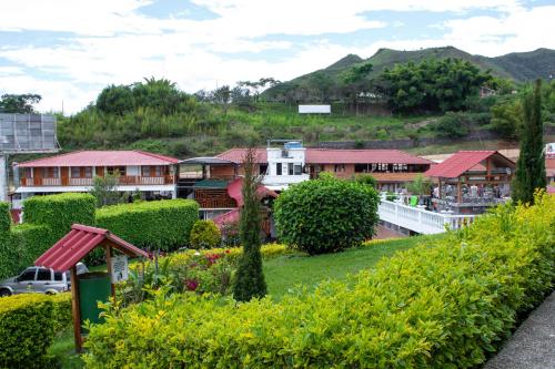 a view of a village with houses and trees at La Gran Estancia Hotel Campestre in Chachagüí