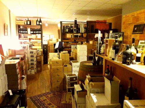 a room full of boxes and bottles of wine at La Grange in Birkenwald