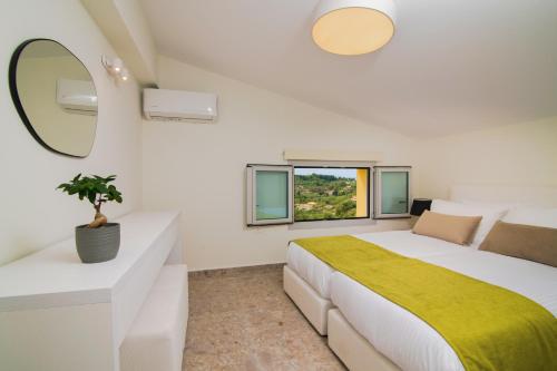 Ένα ή περισσότερα κρεβάτια σε δωμάτιο στο Kaletzia villas