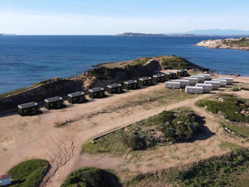 an aerial view of a group of buildings on an island at Abbatoggia Village in La Maddalena