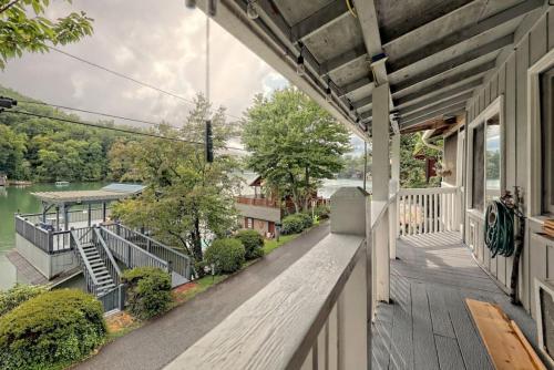 a porch of a house with a view of the water at Hannahs Perch on Lake Burton with Private Top Patio and Bottom Dock in Clayton