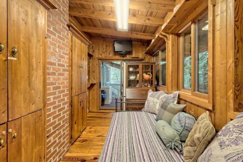 a living room with a couch in a tiny house at Hannahs Perch on Lake Burton with Private Top Patio and Bottom Dock in Clayton