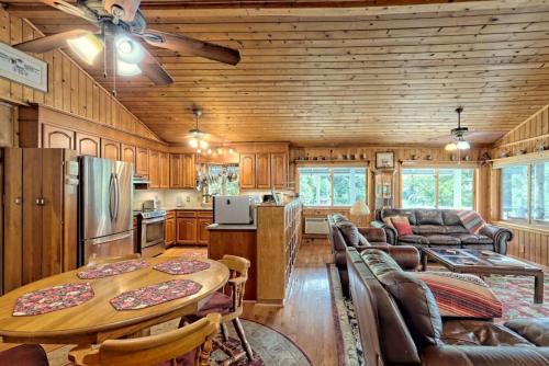 a kitchen and living room with a wooden ceiling at Hannahs Perch on Lake Burton with Private Top Patio and Bottom Dock in Clayton