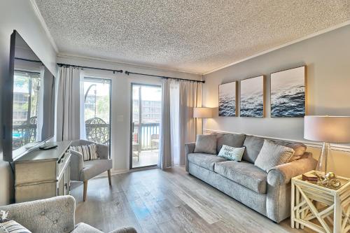 a living room with a couch and a table at Beach &nightlife 3BR/2.5 BA service dog friendly in Myrtle Beach